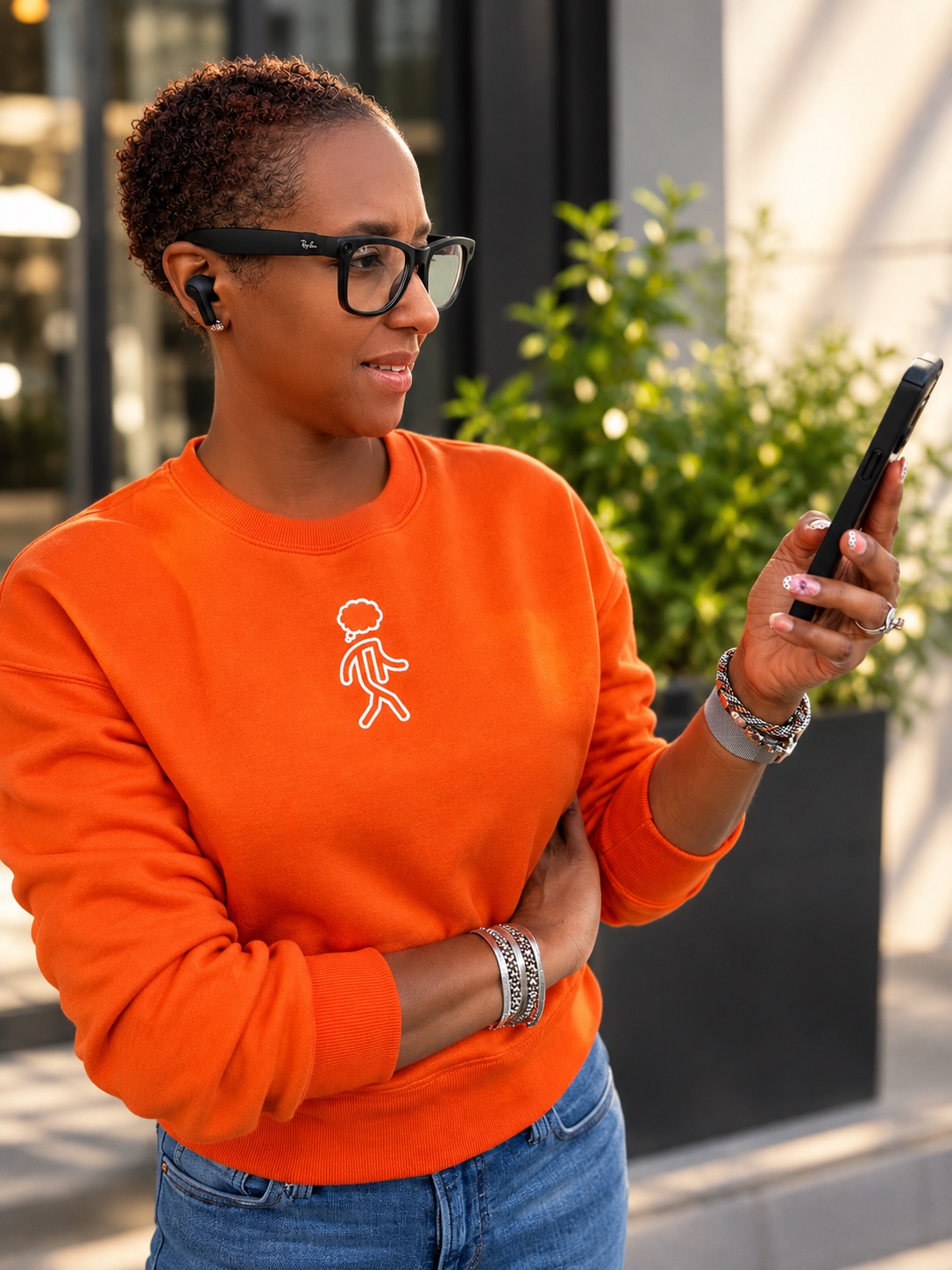 Listener wearing wireless earbuds while looking at her phone